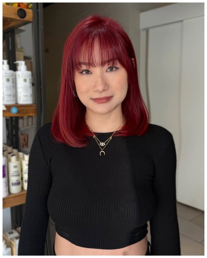 62. Smooth Medium Bob with Vibrant Red Highlights