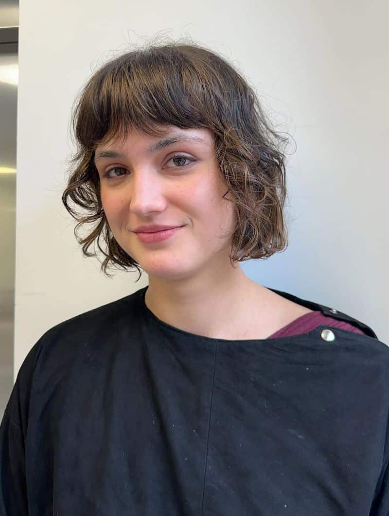 3. Textured Curly Bob with Bangs