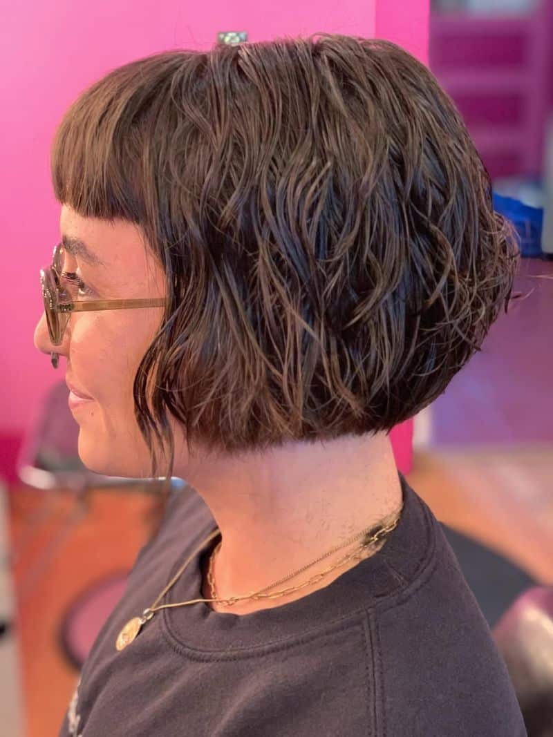 34. Textured Curly Bob with Micro Bangs
