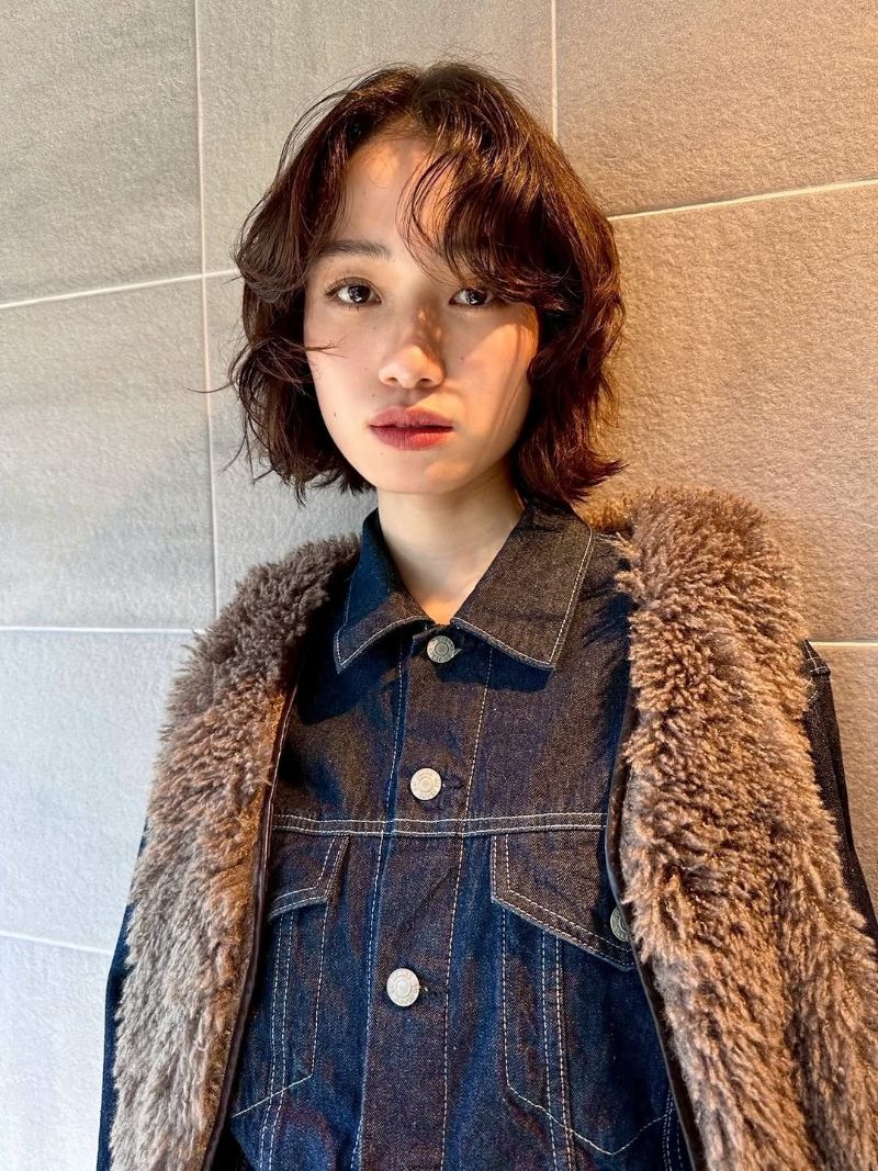 57. Tousled Textured Bob with Wispy Bangs