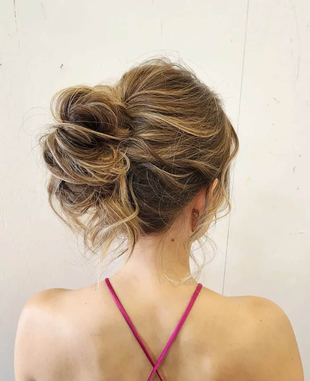 22. Twisted Loose Bun with Soft Curls