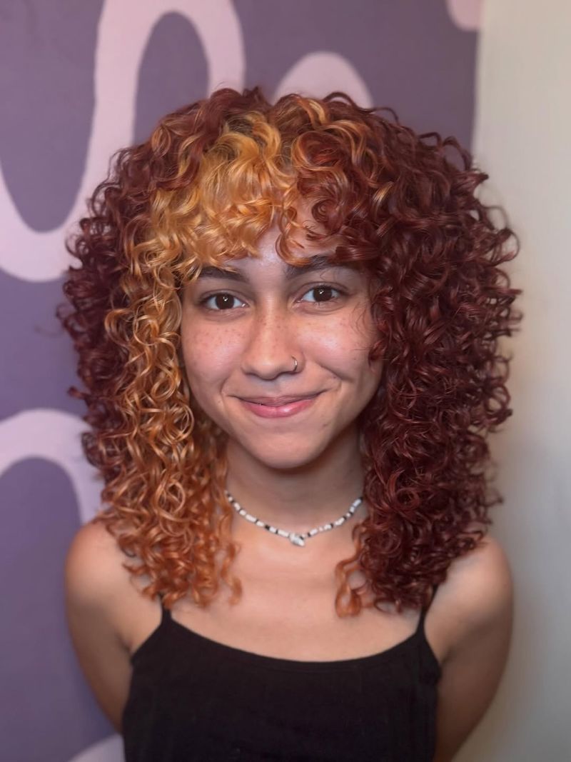 29. Vibrant Two-Tone Curly Hair