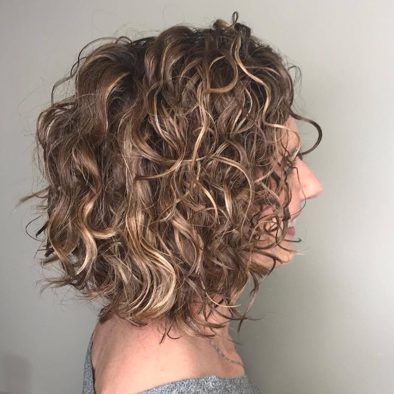35. Voluminous Layered Curly Bob