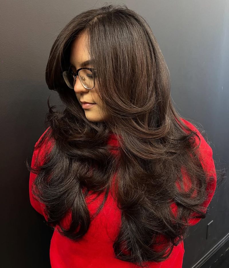 51. Voluminous Long Layers with Face-Framing Bangs