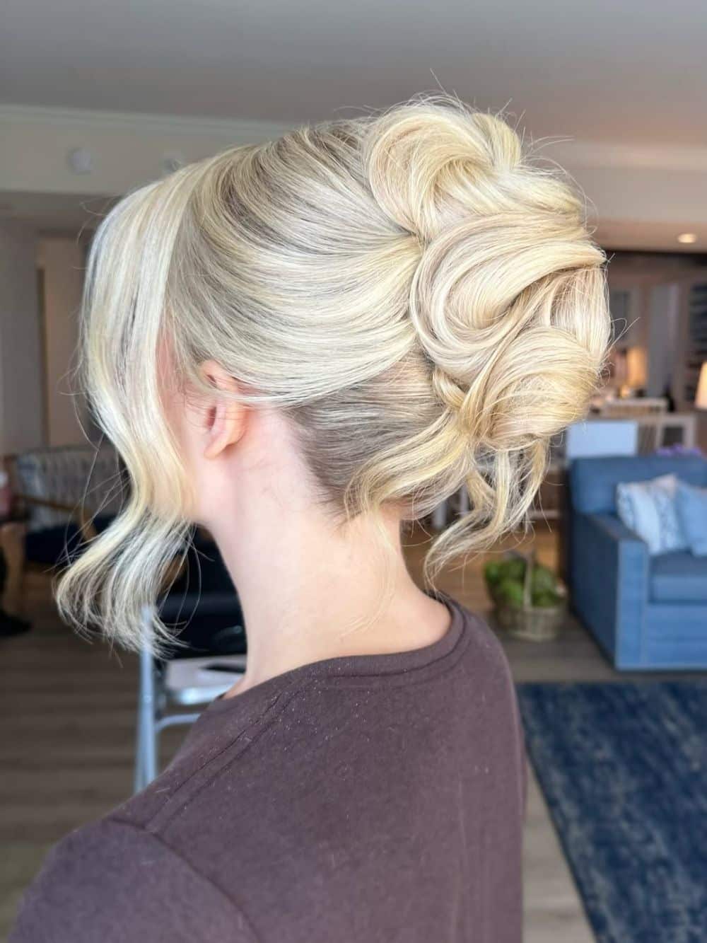 15. Voluminous Twisted Updo with Loose Strands