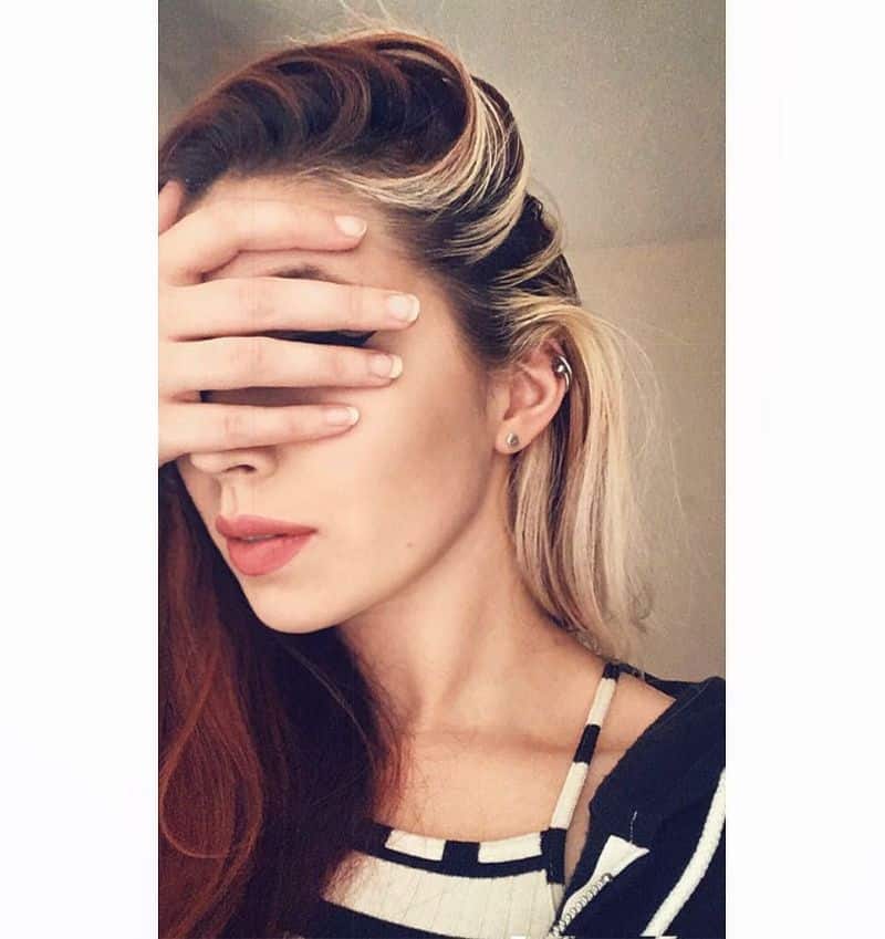 20. Retro-Inspired Side Part with Two-Tone Highlights