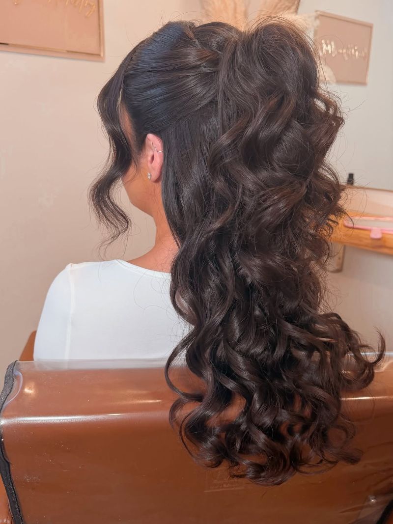 37. Romantic High Ponytail with Voluminous Curls
