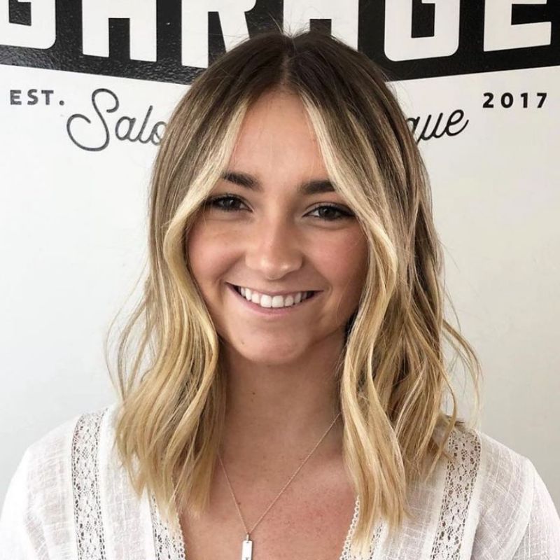 34. Textured Balayage Bob with Side-Swept Bangs
