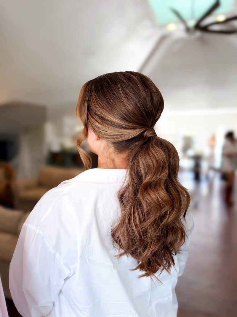 10. Textured Low Ponytail with Side Sweep