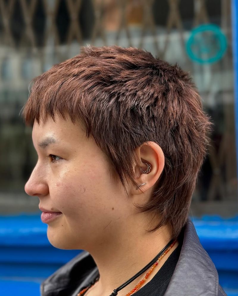 2. Textured Short Pixie with Sharp Bangs