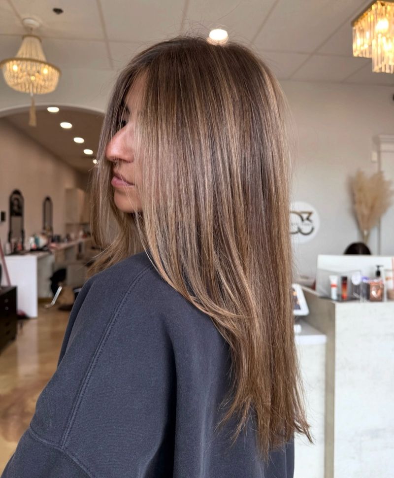 32. Ash Brown Highlights on Long Straight Hair