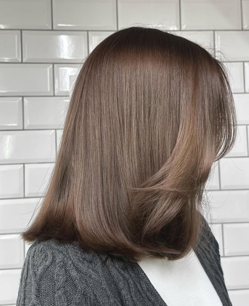 30. Ash Brown Lob with Soft Face-Framing Layers