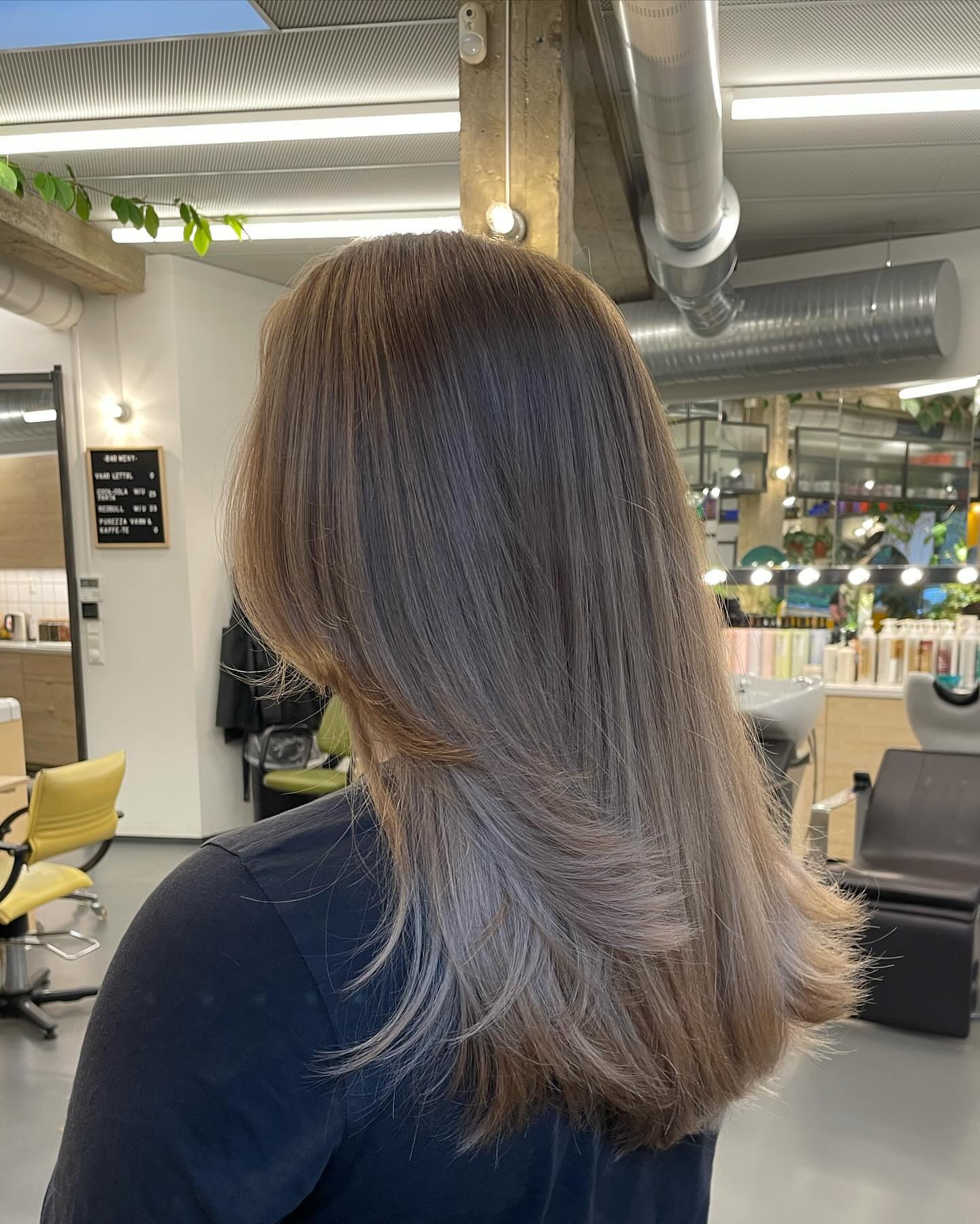 31. Ashy Bronde with Soft Feathered Layers