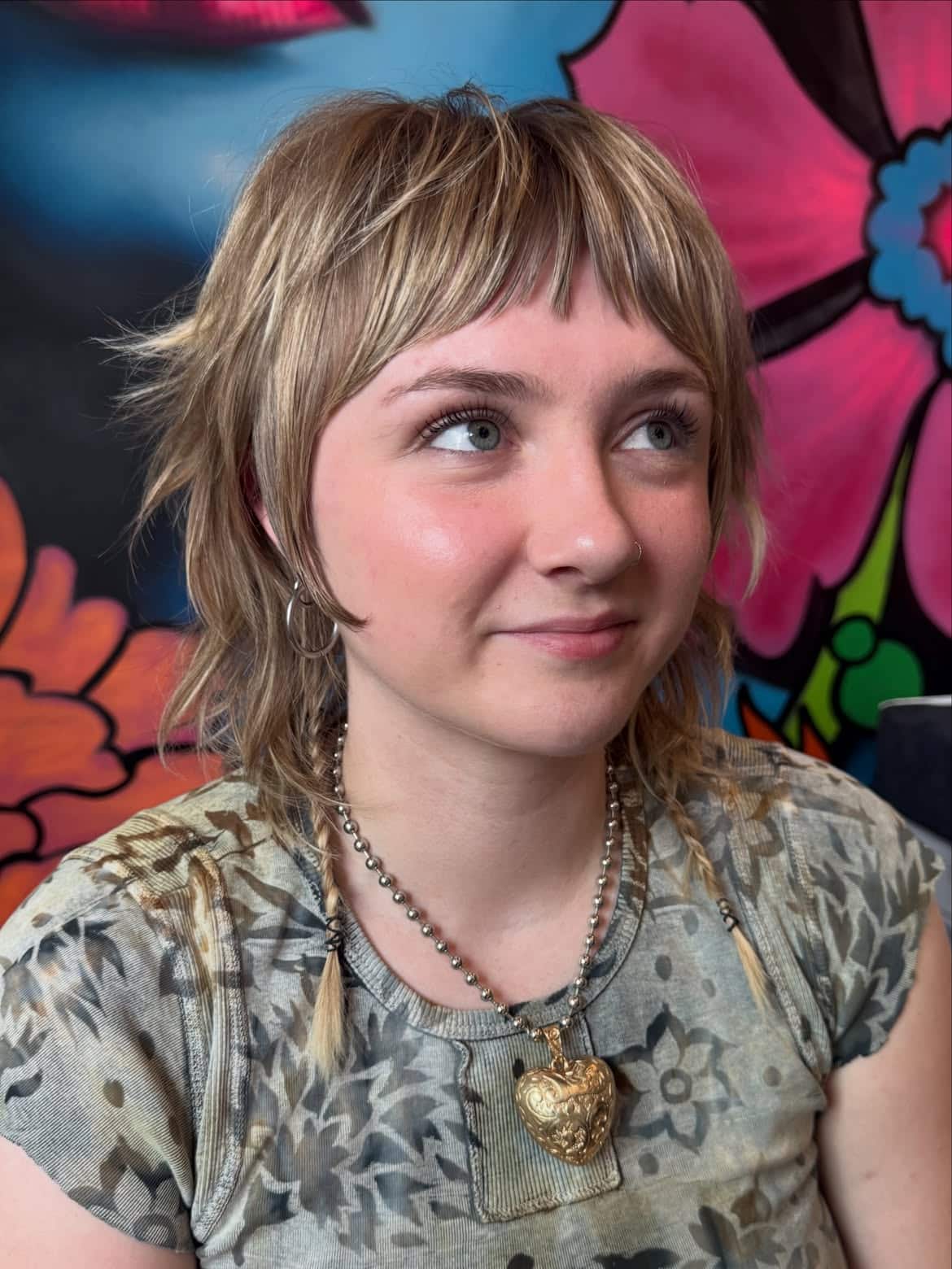 15. Blonde Shaggy Mullet with Baby Bangs and Braided Tails