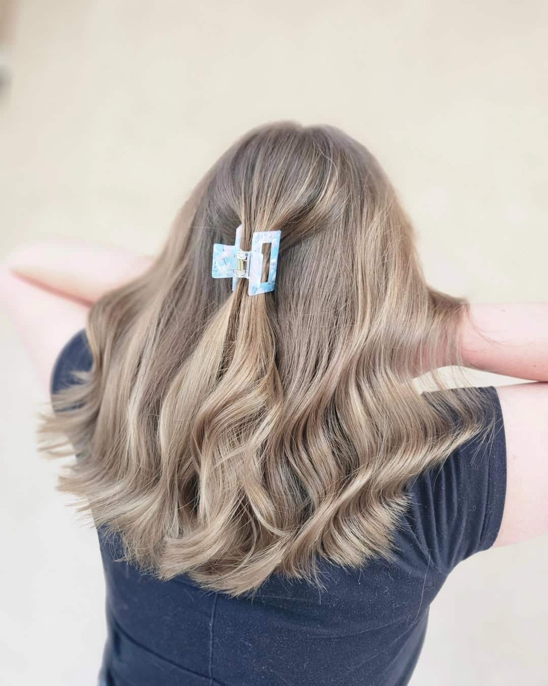 46. Blue Claw Clip Half-Up Hairstyle