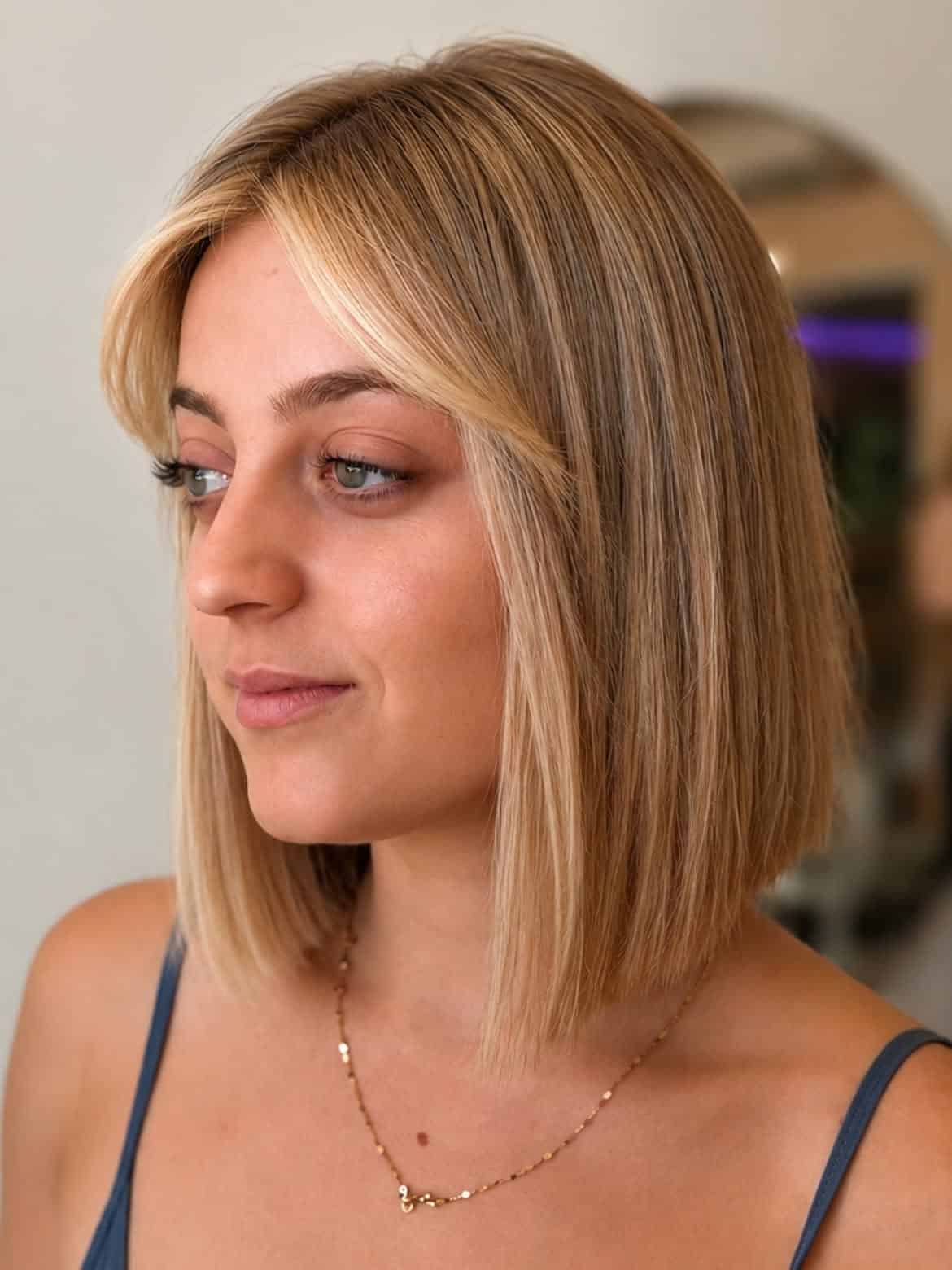 40. Blunt Golden Blonde Bob with Curtain Bangs