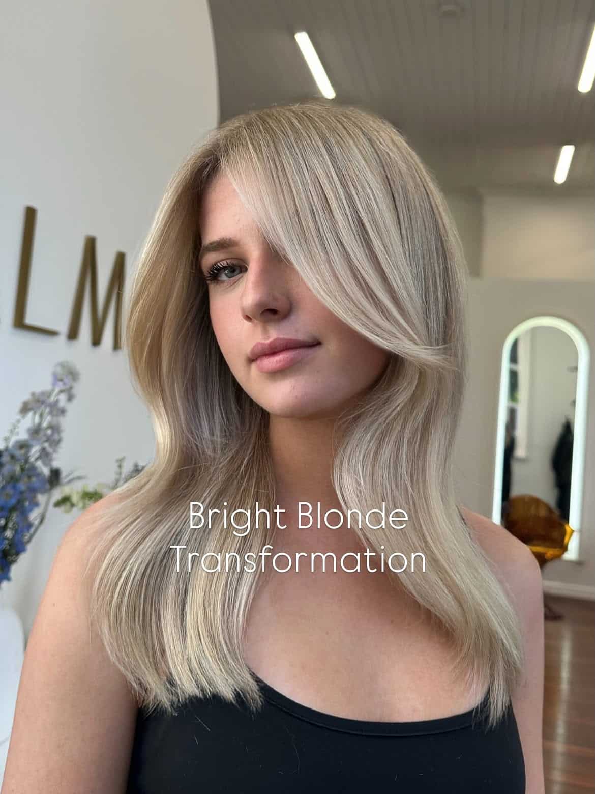 21. Bright Blonde Transformation with Side Swept Bangs