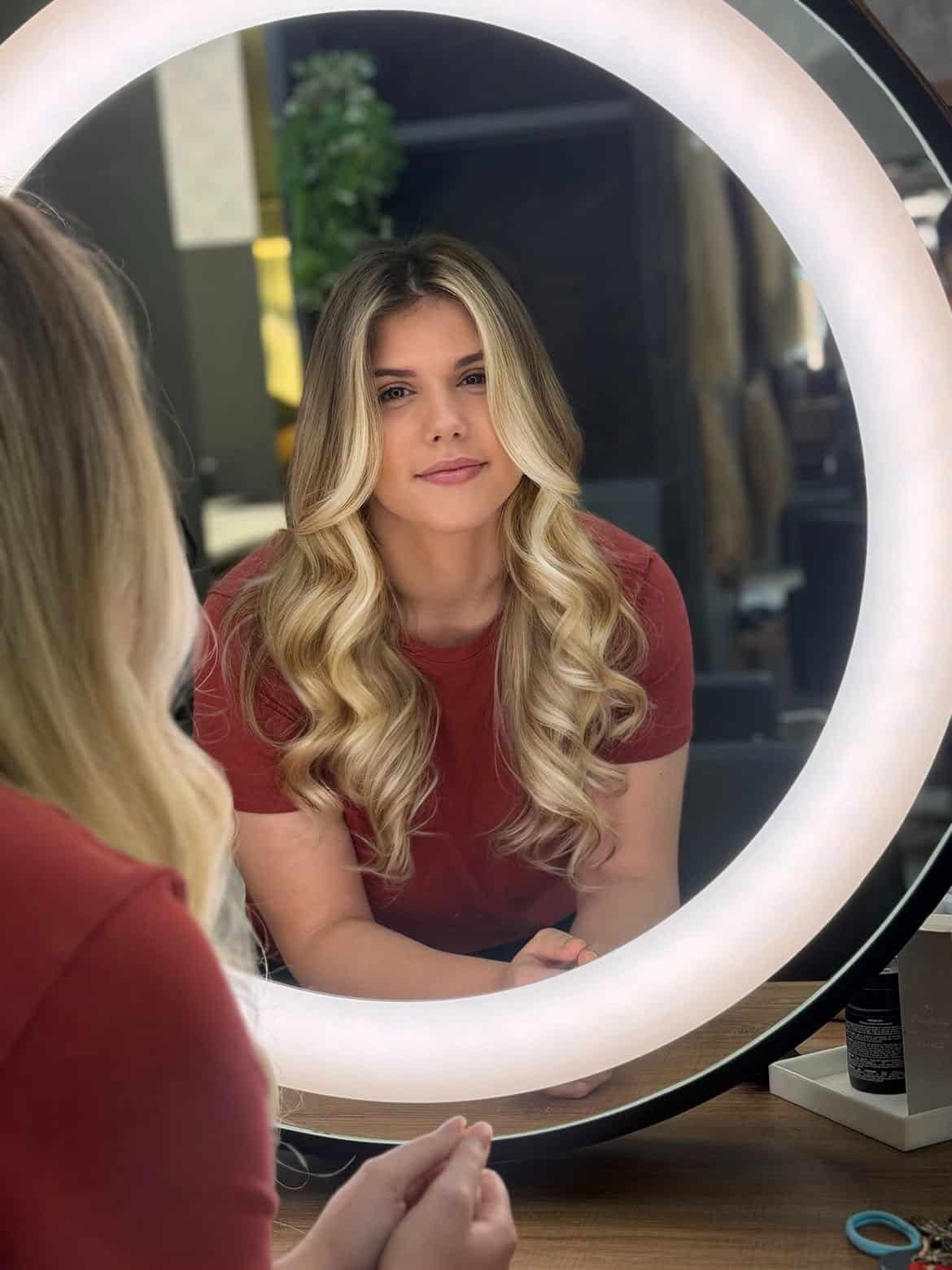 59. Bright Face-Framing Butter Blonde Curls