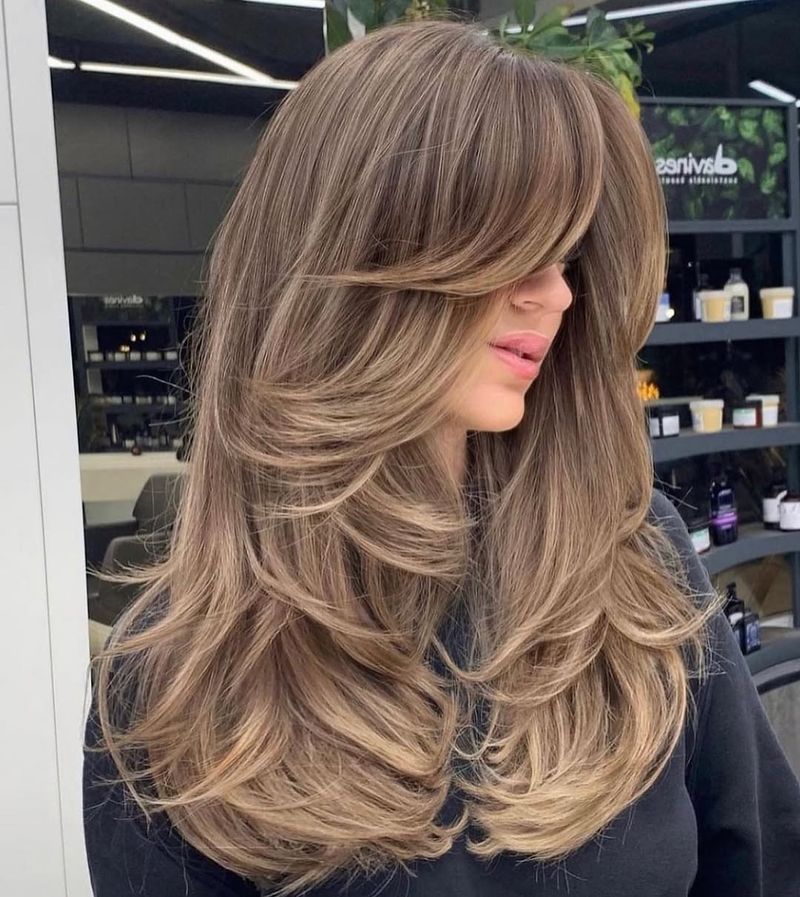 33. Bronde Butterfly Layers with Thick Feathered Bangs