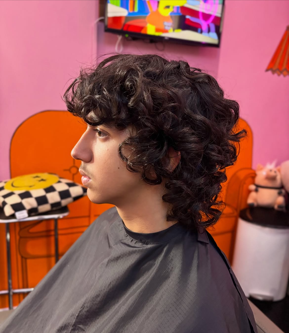 26. Brow-Skimming Curl Mullet