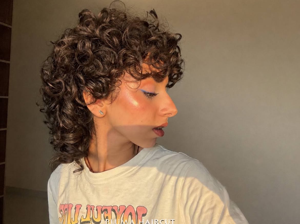 6. Brunette Volume with Tightly Coiled Bangs