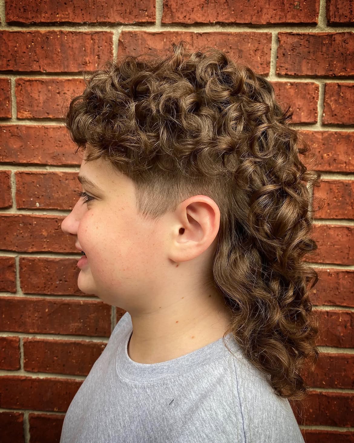 36. Buzzed Sides Curly Mullet