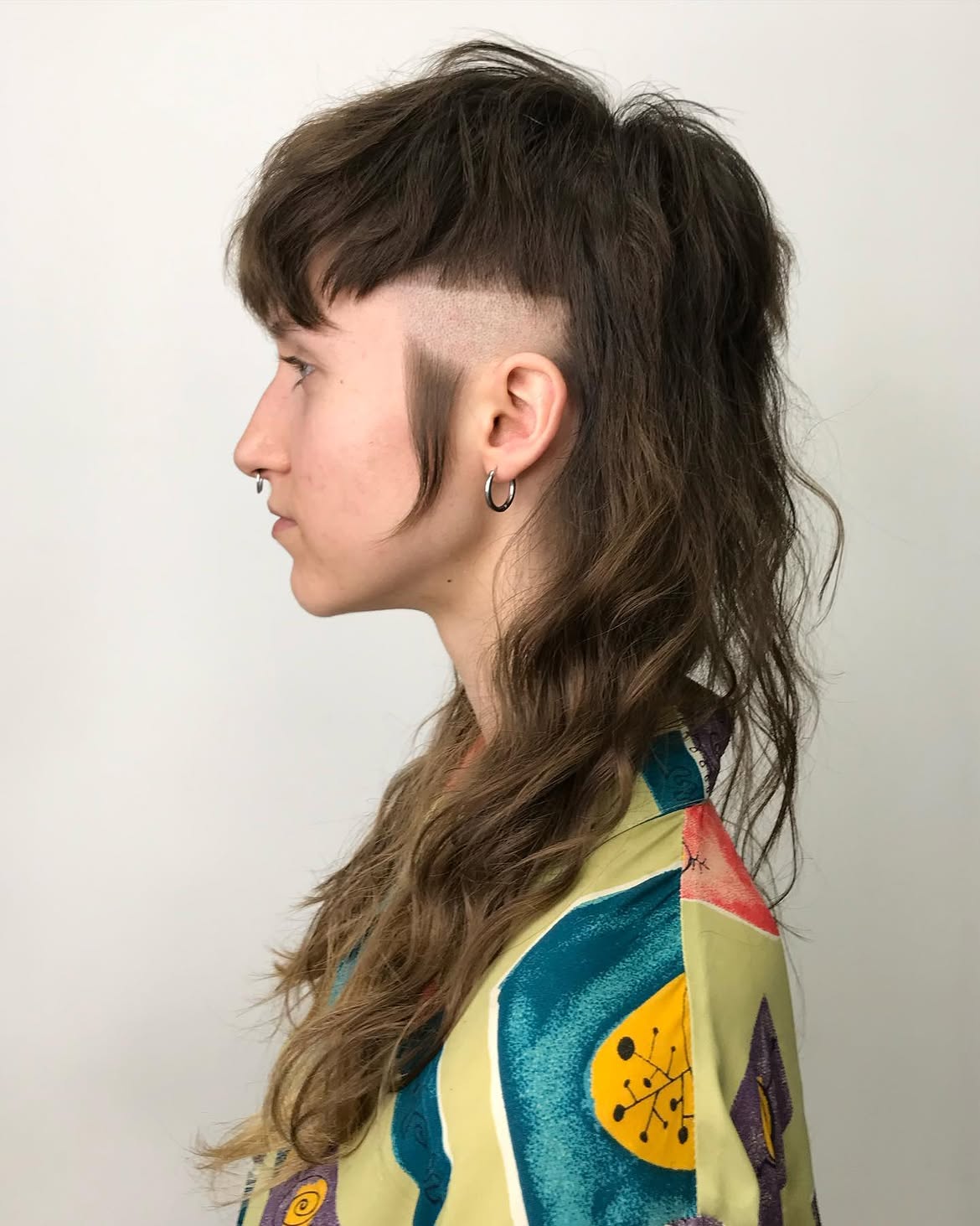 46. Buzzed Temple Shag Mullet with Choppy Micro Bangs