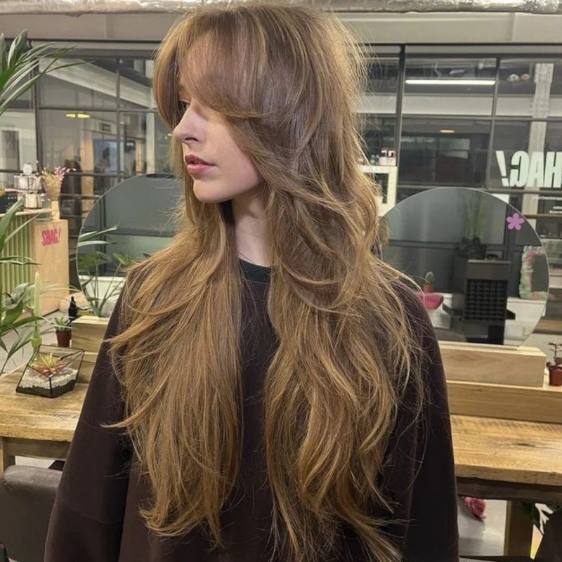 14. Caramel Layers with Curtain Bangs
