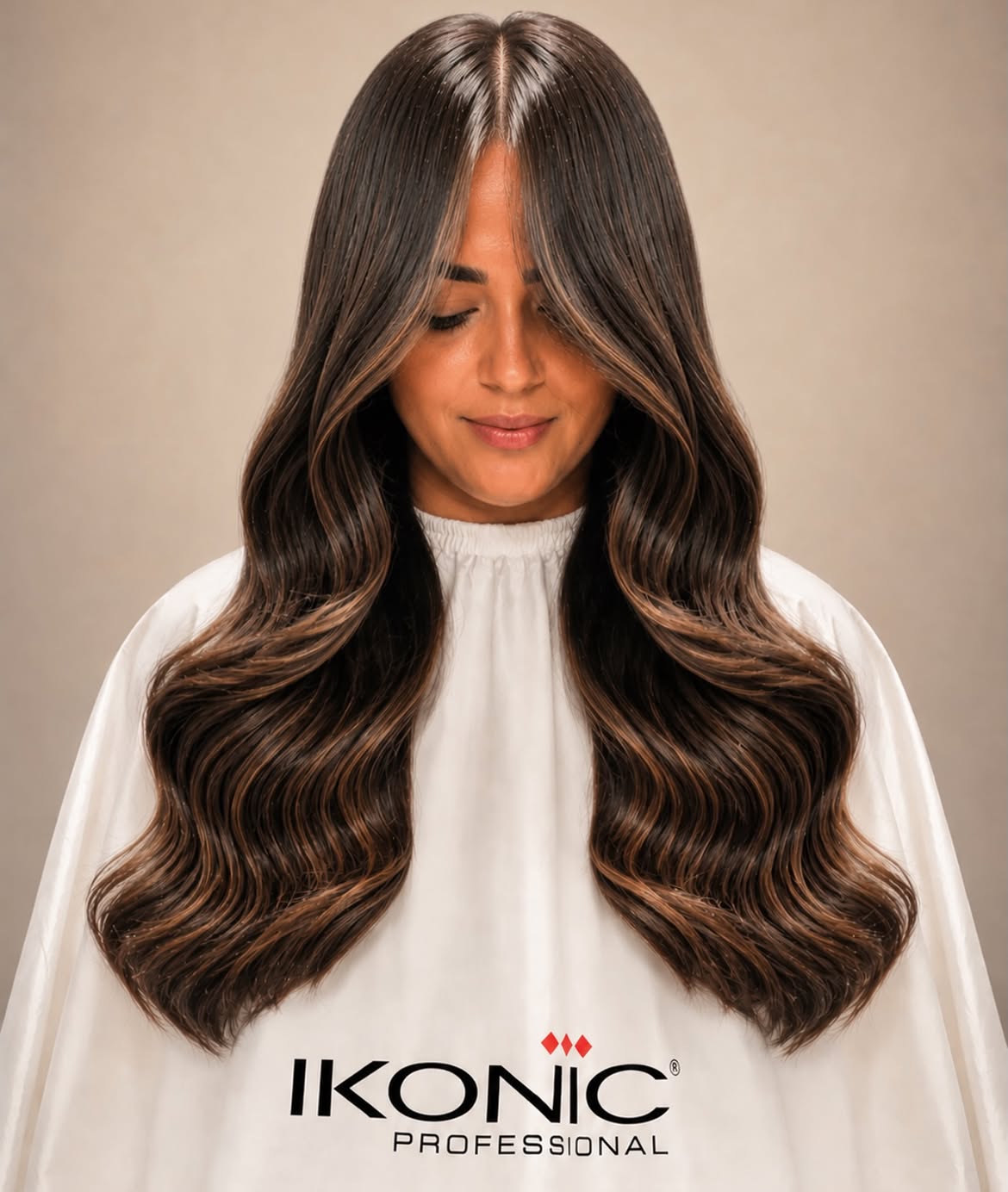 55. Center-Parted Brunette Waves with Caramel Face Frame