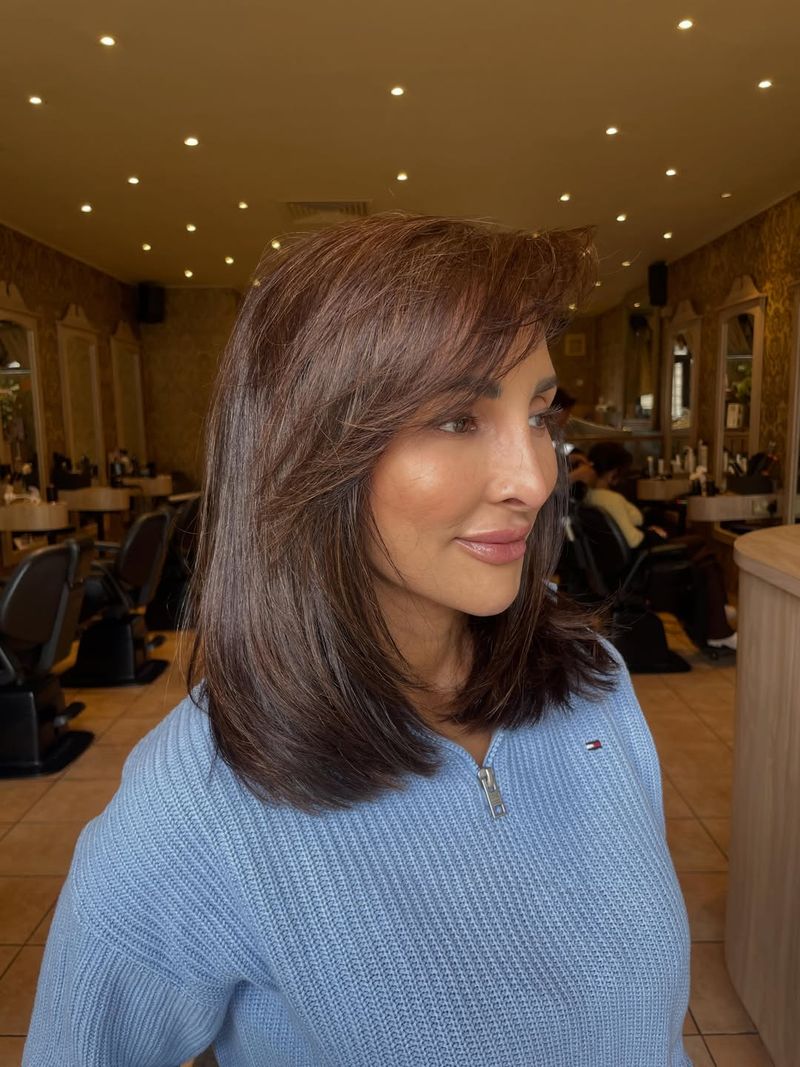 52. Chestnut Layered Lob with Side Swept Bangs