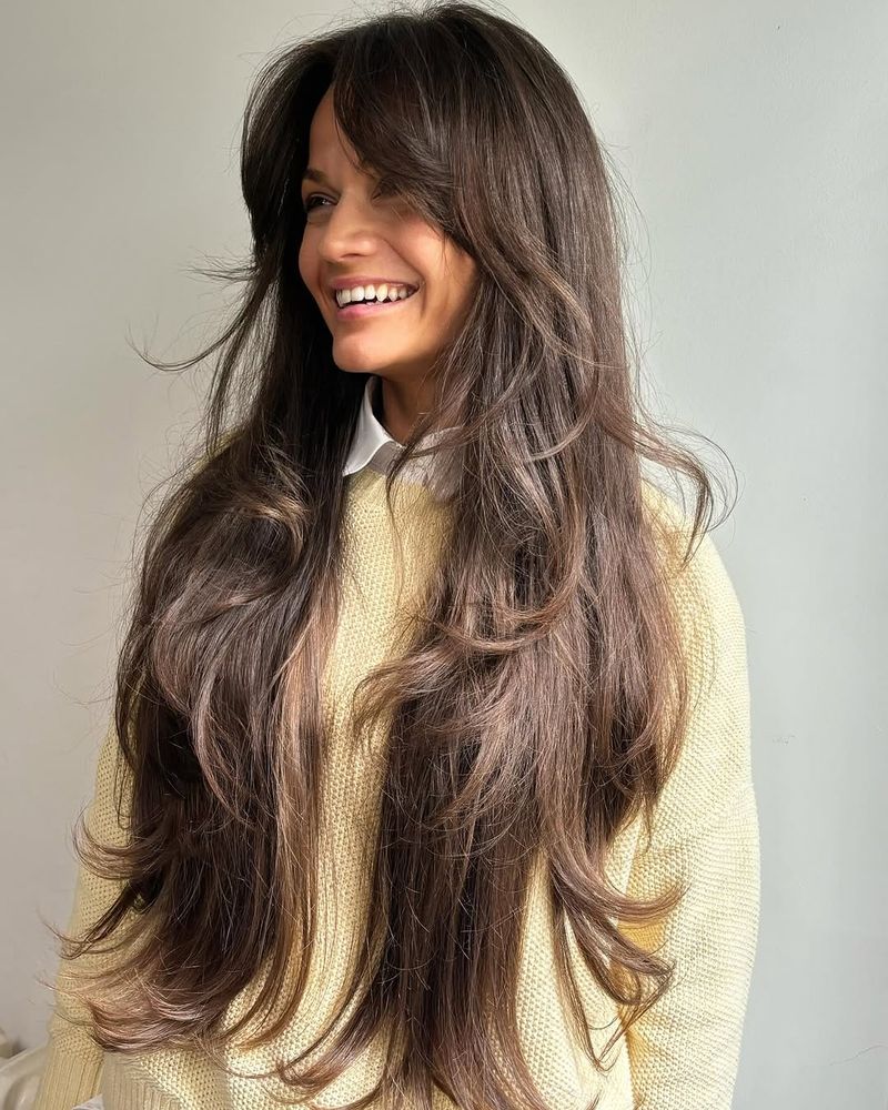 7. Chestnut Layers with Curtain Bangs