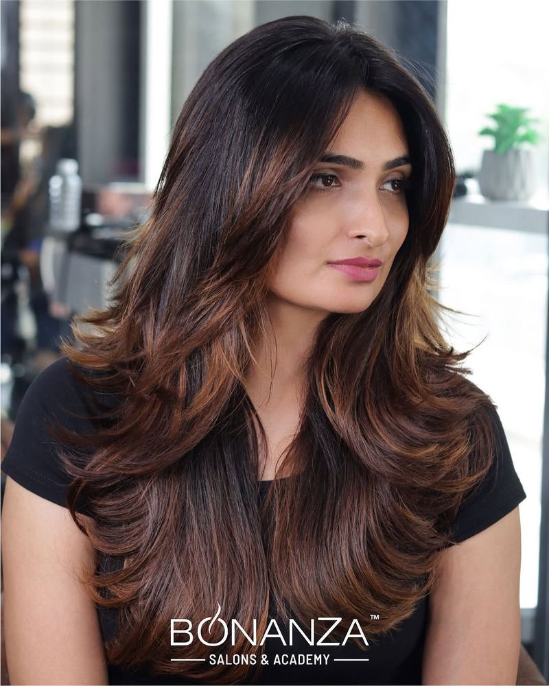 54. Chestnut Layers with Soft Sweeping Bangs