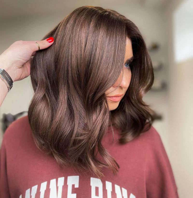 31. Chestnut Lob with Side Swept Bangs