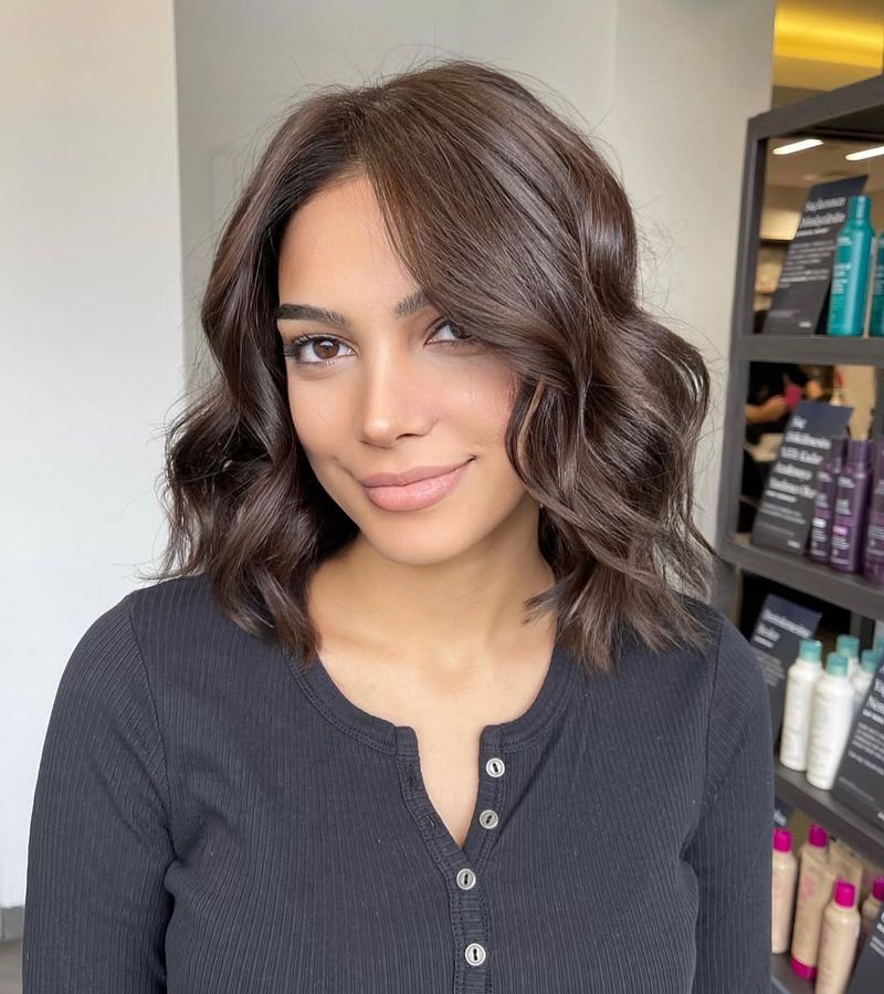 54. Chestnut Waves with Soft Side-Parted Bangs