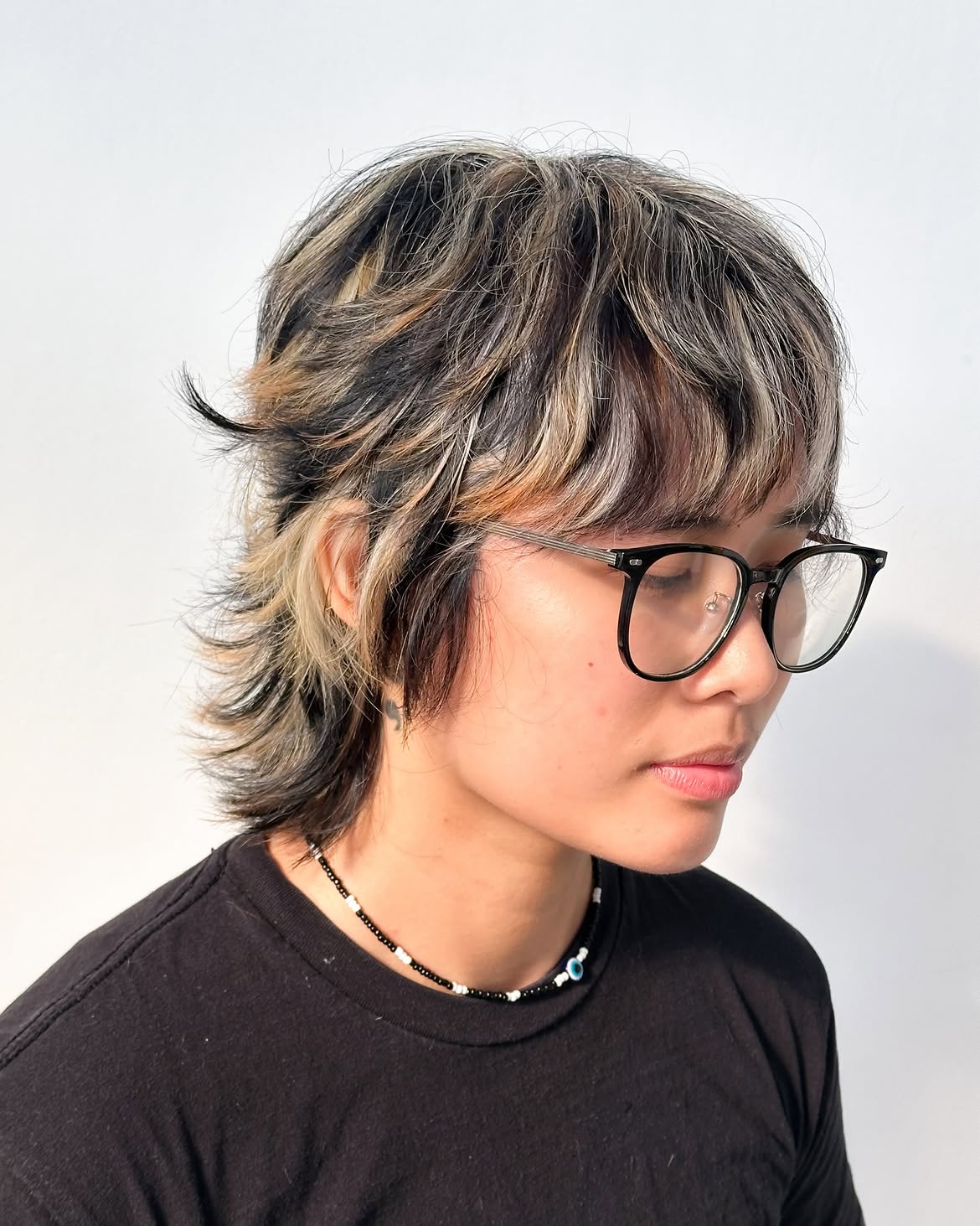 27. Chunky Highlight Shag Mullet with Wispy Bangs