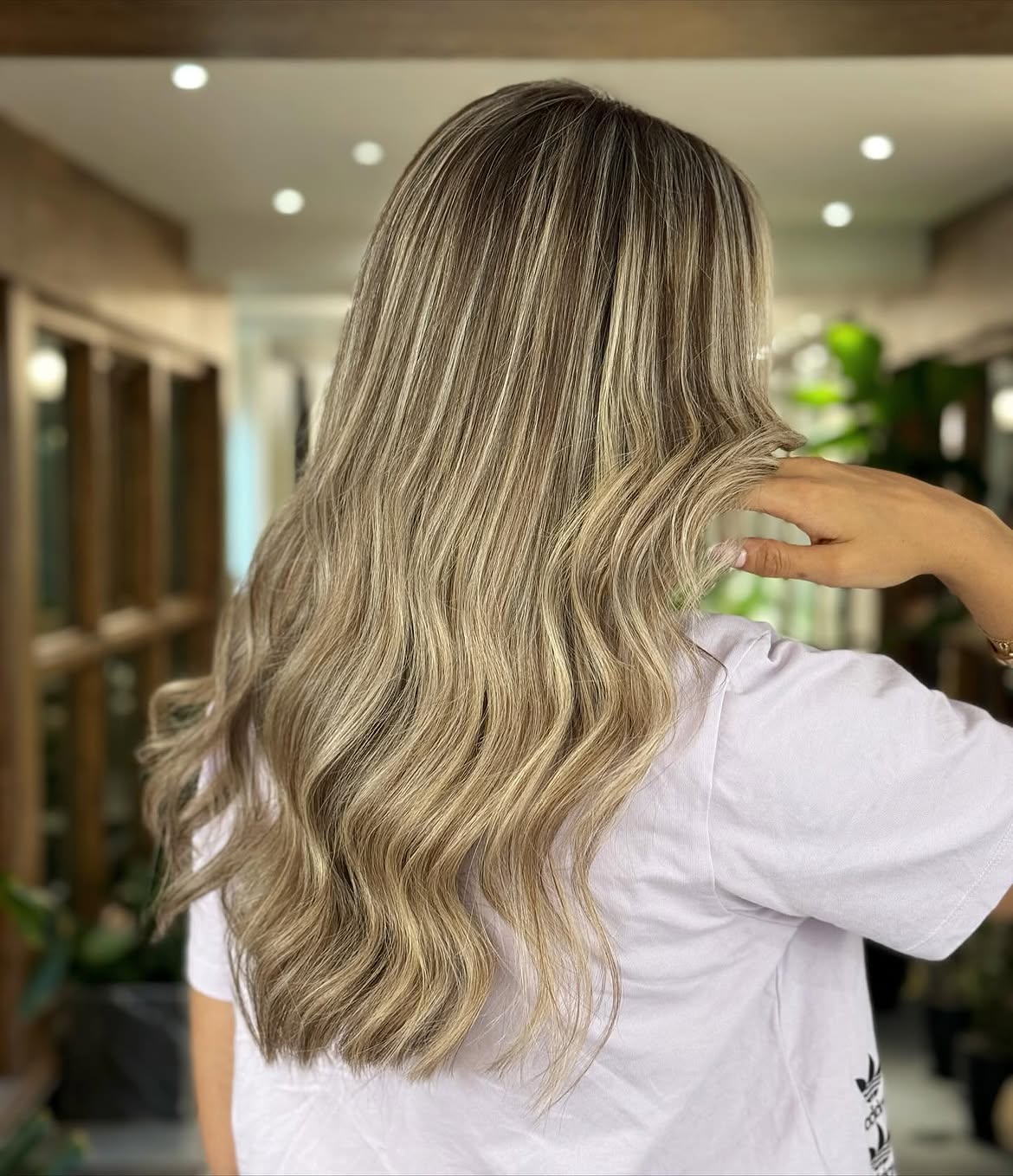 33. Cool-Toned Honey Balayage with Soft Waves