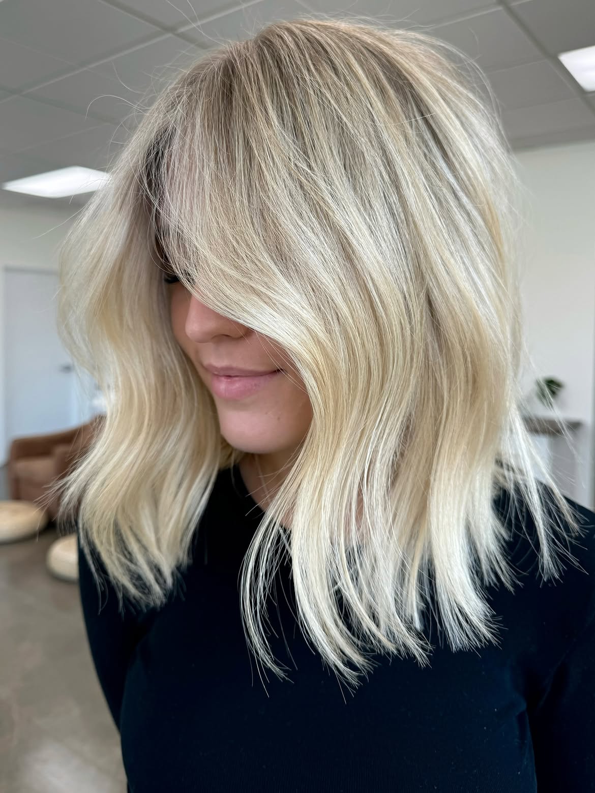 22. Creamy Blonde Lob with Curtain Bangs