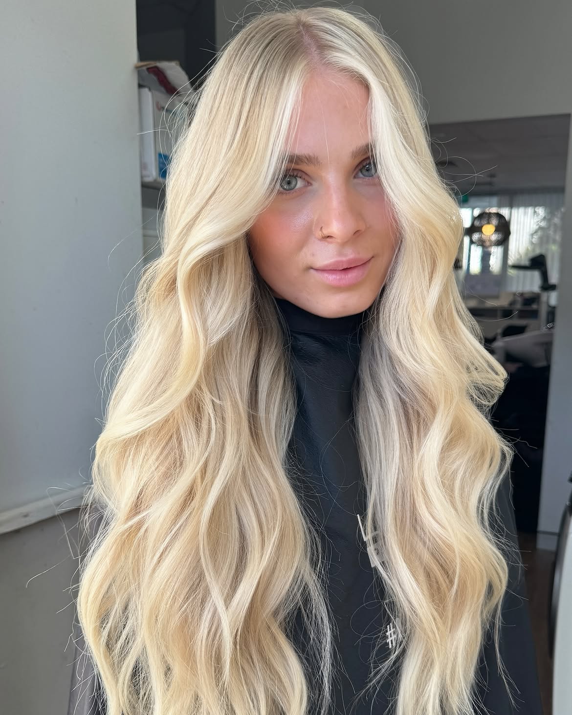 7. Creamy Curtain Bangs and Cascading Waves