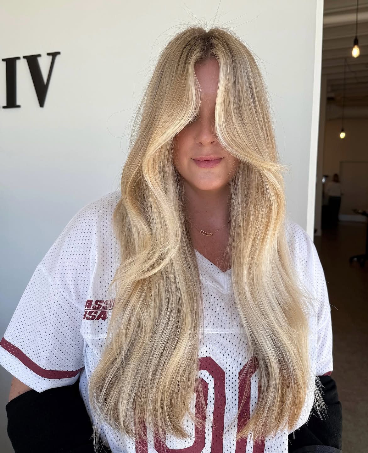 2. Creamy Curtain Bangs and Long Layers