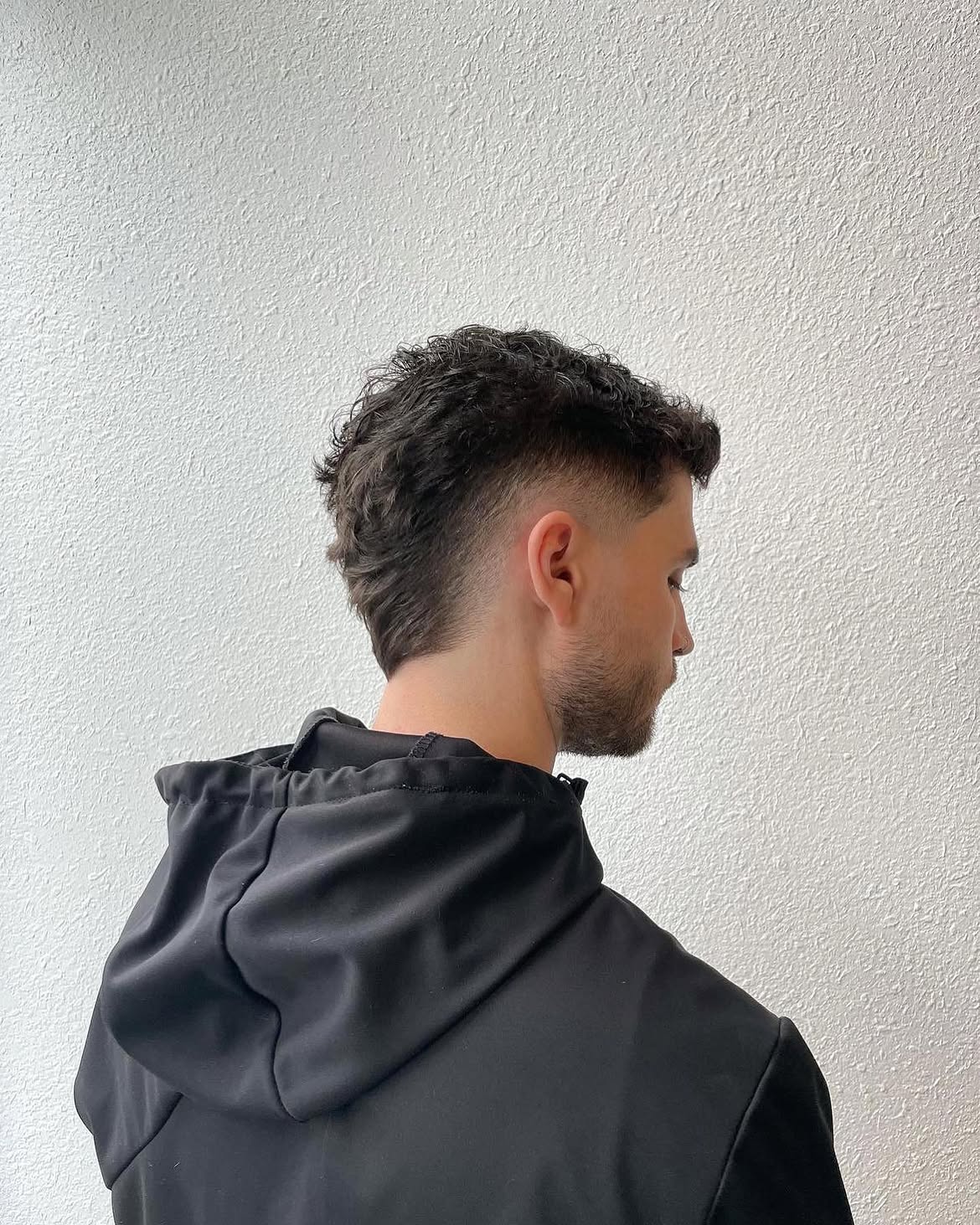 15. Curly Burst Fade Mullet