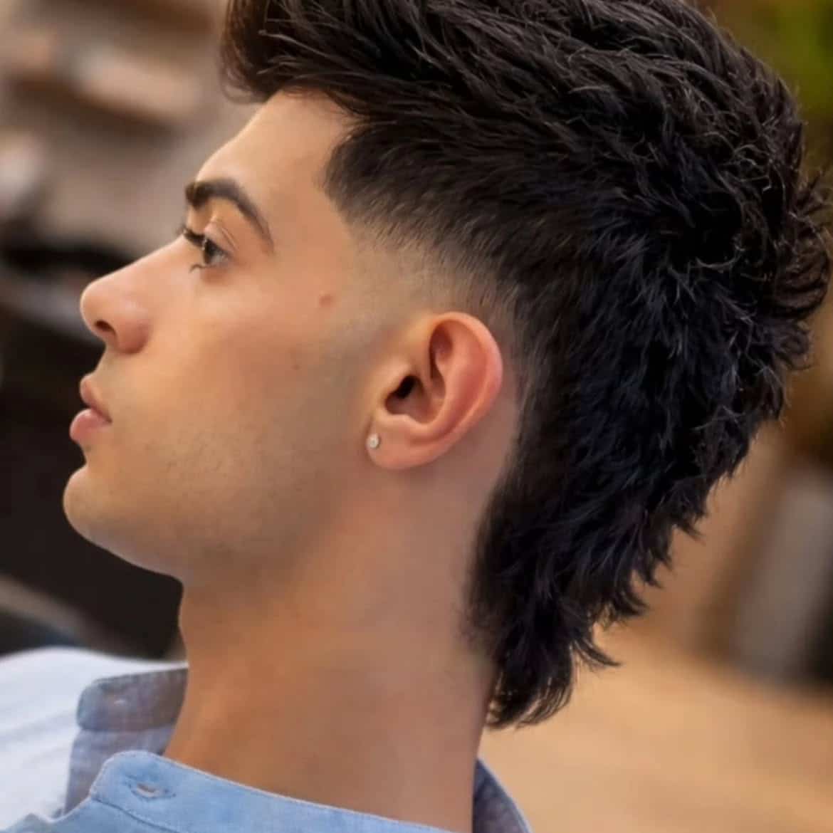 18. Curly Burst Fade Mullet