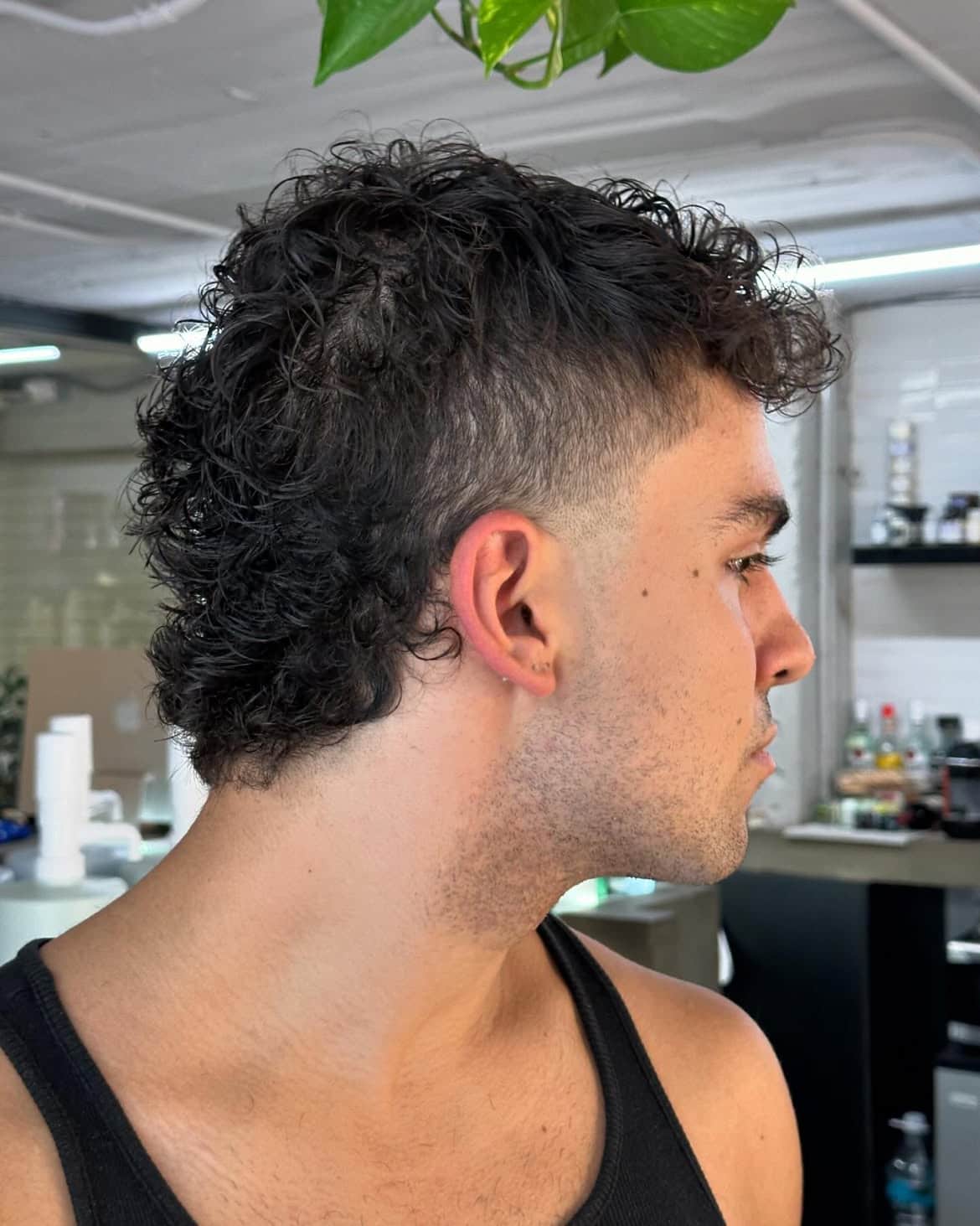 8. Curly Burst Fade Mullet