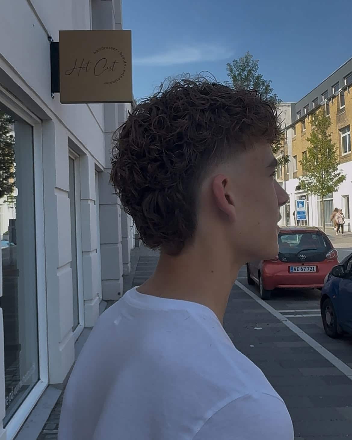 23. Curly Burst Fade Mullet