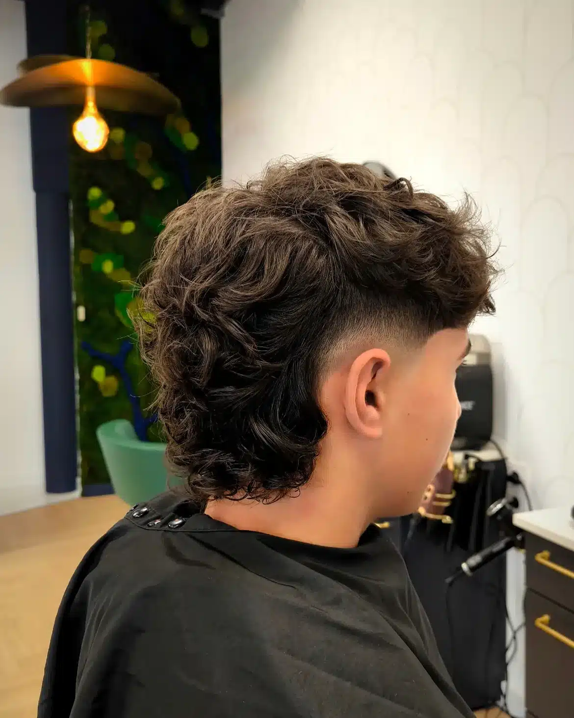 21. Curly Burst Fade Mullet