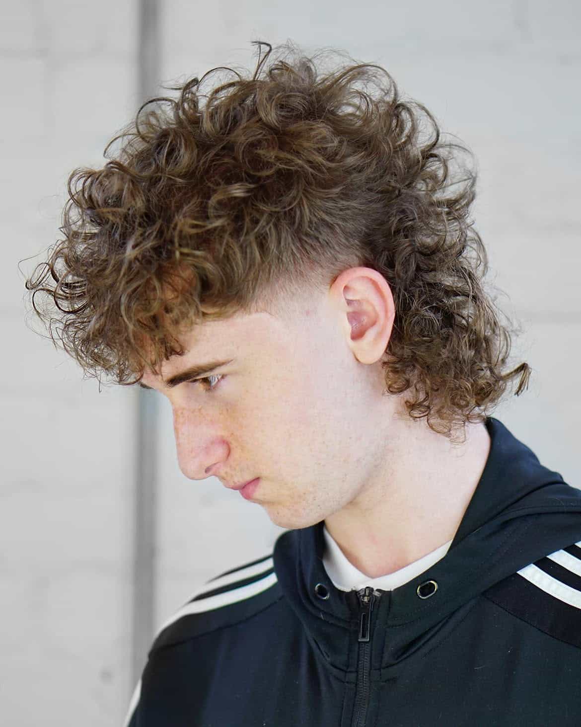 6. Curly Drop Fade Mullet