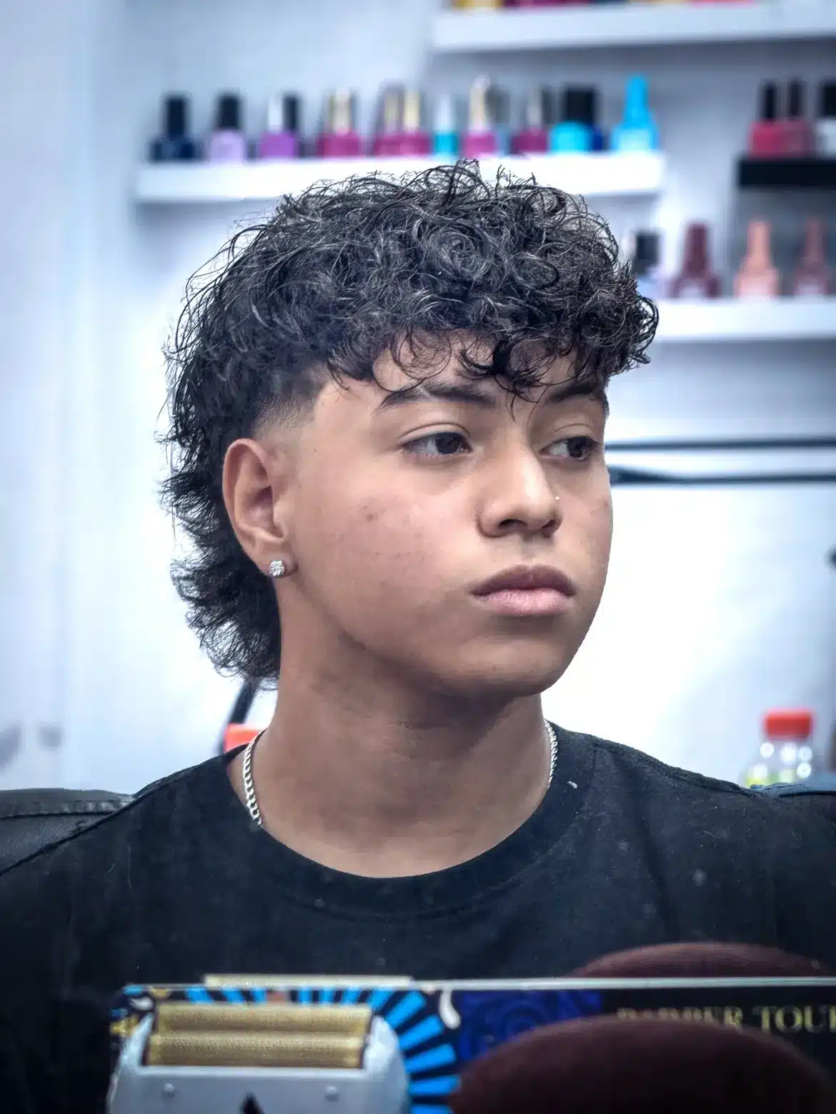 2. Curly Fringe Mullet with Low Taper Fade