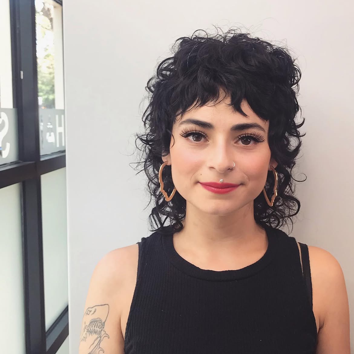 4. Curly Micro-Bang Shag Mullet