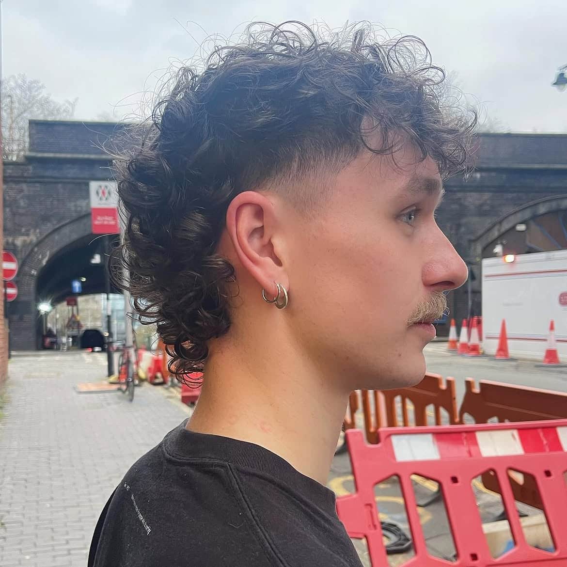 18. Curly Mullet with Mid Skin Fade