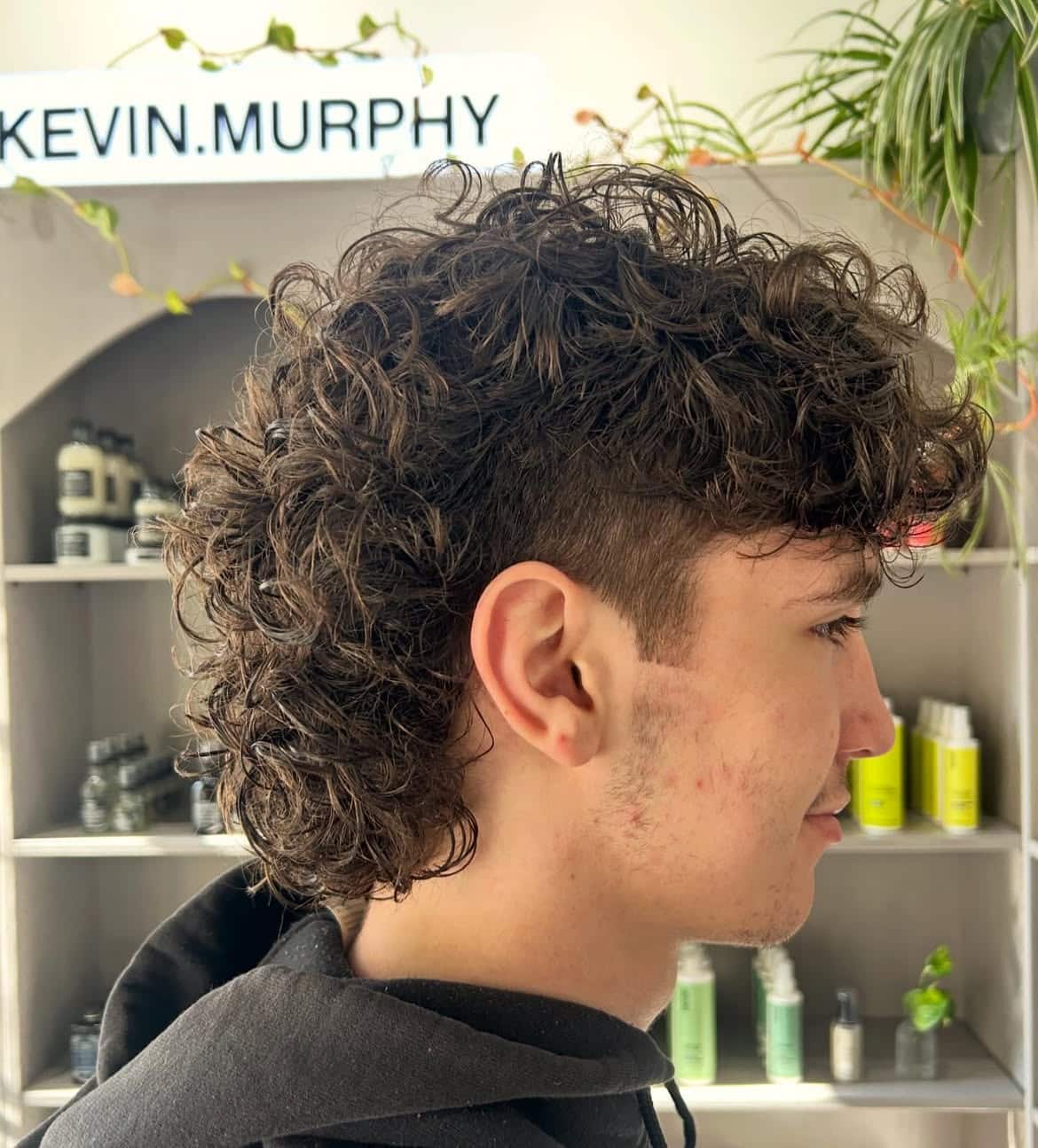 31. Curly Mullet with Tapered Sides and Full Fringe