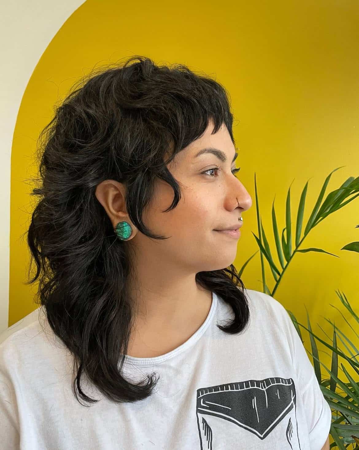 29. Curly Shag Mullet with Baby Bangs